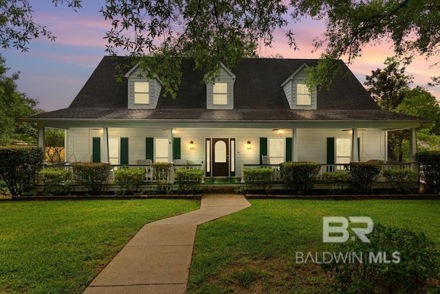 6505 Charing Wood Dr, Mobile, AL 36695 - farmhouse-style home with a porch and a lawn