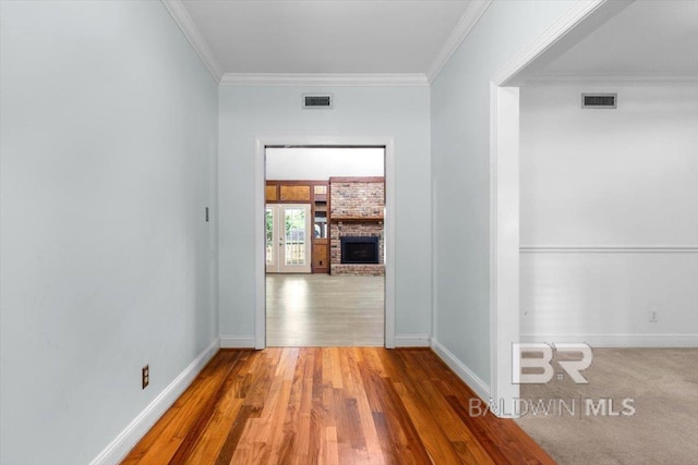 6505 Charing Wood Dr, Mobile, AL 36695 - hall featuring crown molding, wood finished floors, and french doors