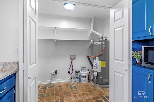 clothes washing area with hookup for a washing machine and gas water heater