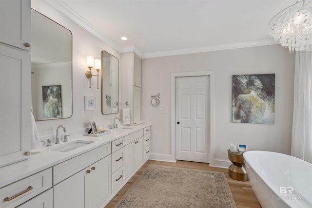 full bath with crown molding, wood finished floors, and a sink
