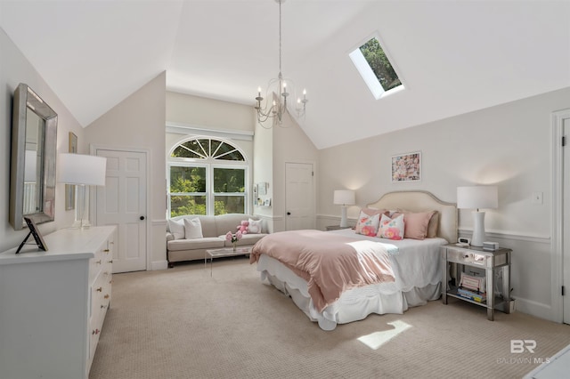 bedroom with light carpet, vaulted ceiling with skylight, and a chandelier