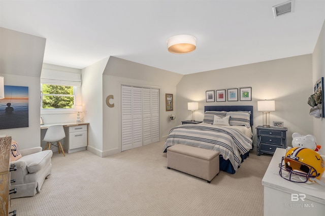 bedroom with baseboards, light carpet, visible vents, and a closet