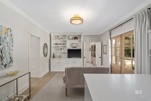 living room featuring baseboards, ornamental molding, french doors, and light wood finished floors