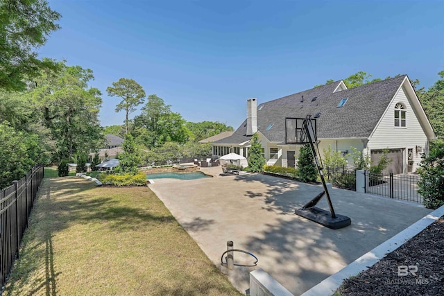 exterior space featuring a fenced in pool and a fenced backyard