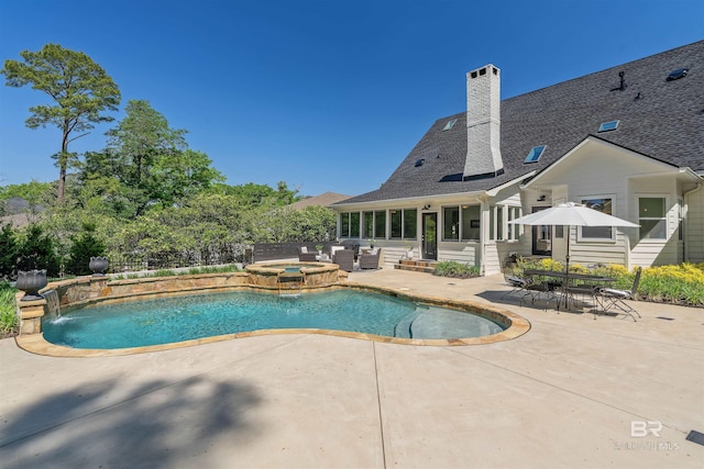 view of pool featuring an outdoor living space, a patio area, and a pool with connected hot tub