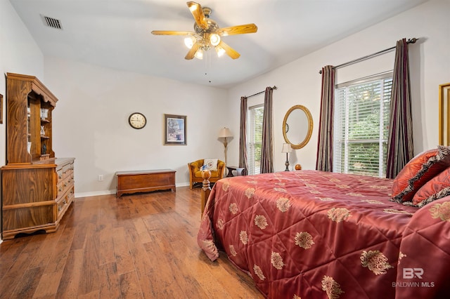 bedroom featuring ceiling fan and hardwood / wood-style flooring