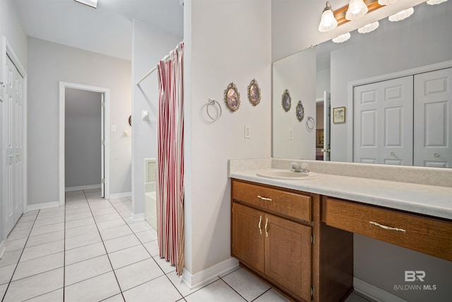 bathroom with tile patterned flooring, vanity, and shower with separate bathtub