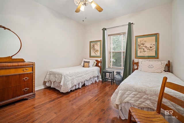 bedroom with hardwood / wood-style flooring and ceiling fan