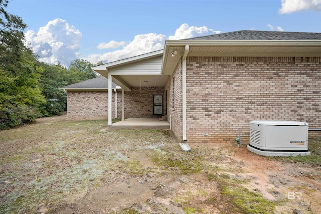 view of side of home with a patio area