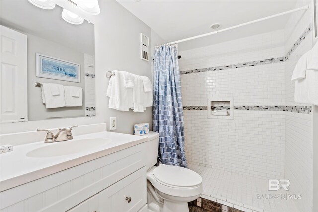 bathroom with vanity, toilet, and a shower with curtain