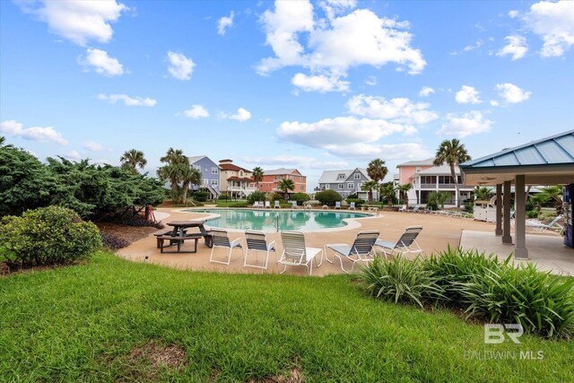 view of swimming pool featuring a yard, a patio, and a gazebo