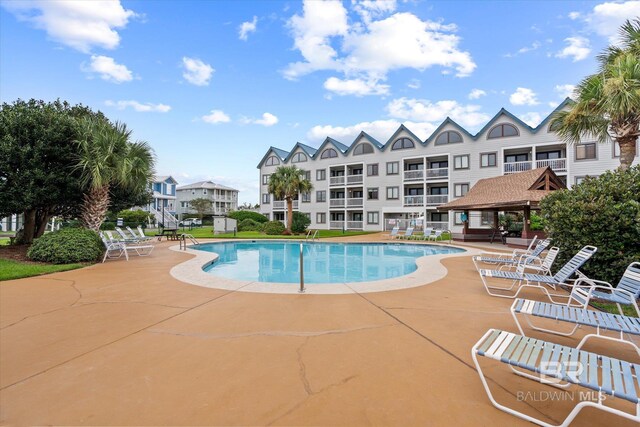 view of swimming pool with a patio area