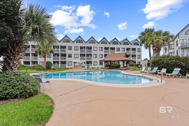 view of swimming pool featuring a gazebo and a patio area