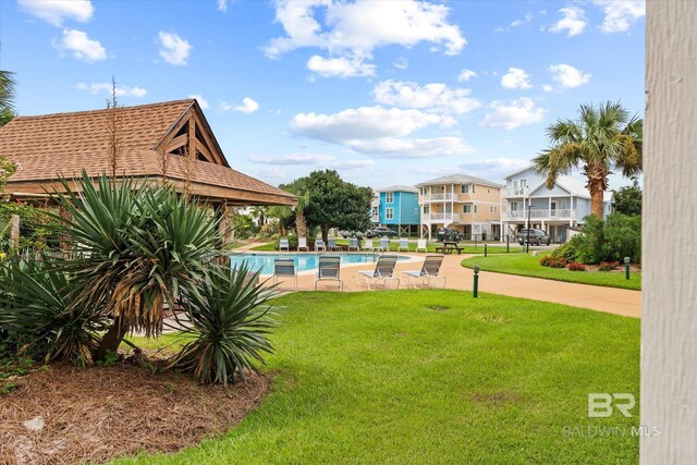 view of yard featuring a community pool