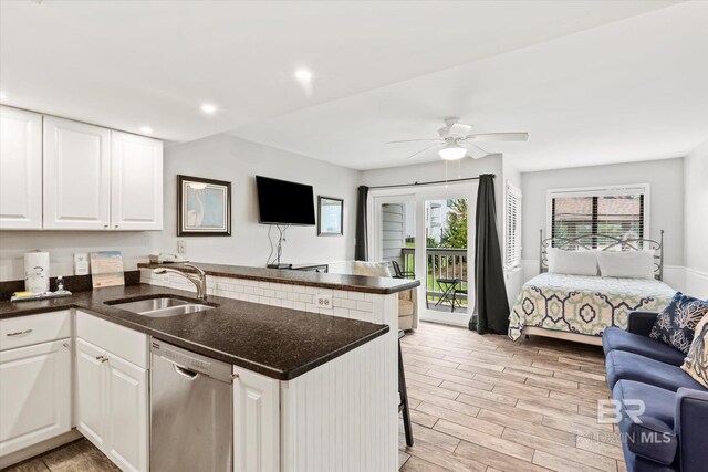 kitchen featuring white cabinetry, dishwasher, kitchen peninsula, sink, and ceiling fan