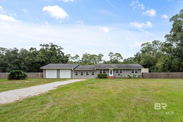 ranch-style house with a garage and a front yard