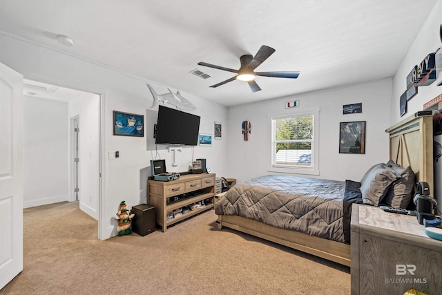 bedroom featuring ceiling fan and light colored carpet