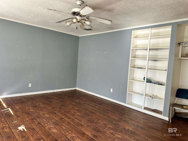 empty room with dark wood-type flooring, a textured ceiling, ceiling fan, and ornamental molding