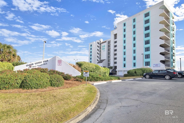 view of property with uncovered parking