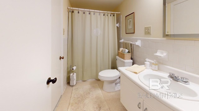 bathroom with walk in shower, tile patterned floors, toilet, vanity, and tile walls