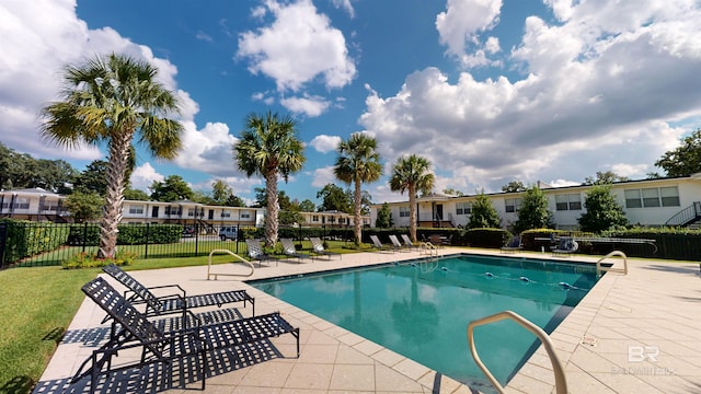 view of swimming pool with a patio area