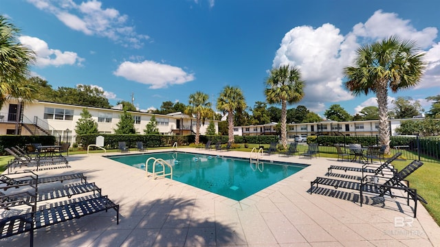 view of swimming pool featuring a patio area