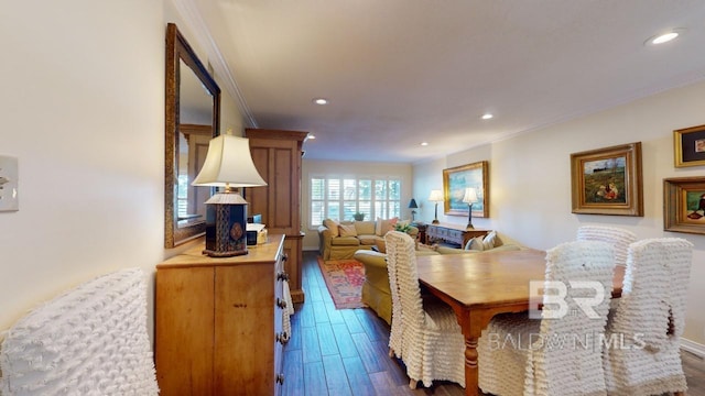 dining room featuring dark hardwood / wood-style flooring and ornamental molding