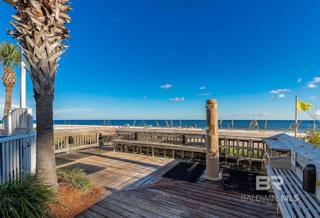 wooden deck with a water view
