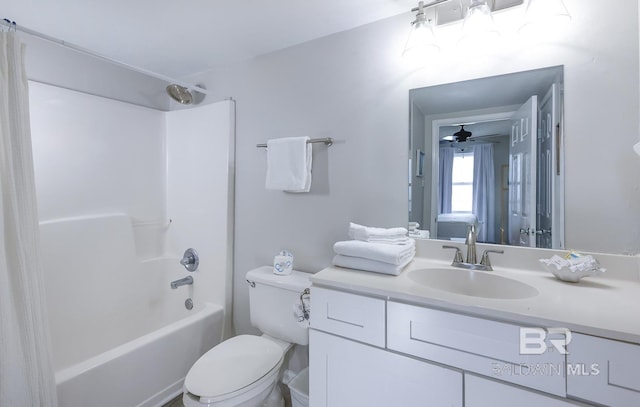 bathroom with toilet, bathing tub / shower combination, vanity, and a ceiling fan