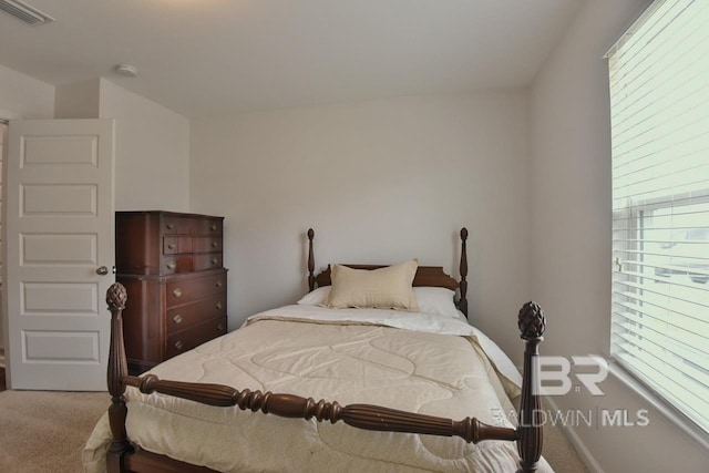 bedroom with visible vents and carpet floors