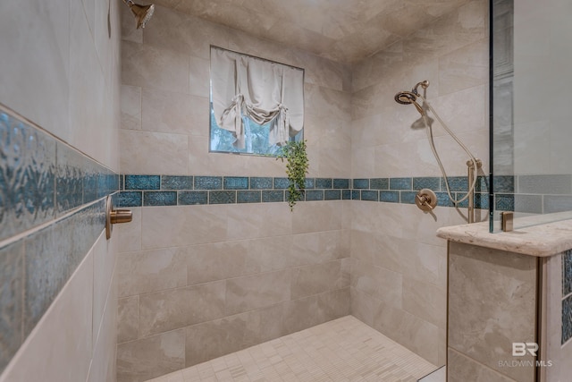 bathroom with tiled shower