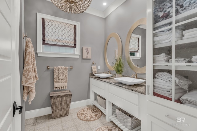 bathroom with vanity and a notable chandelier