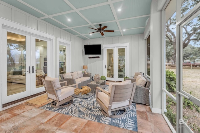 sunroom / solarium with coffered ceiling, french doors, and ceiling fan