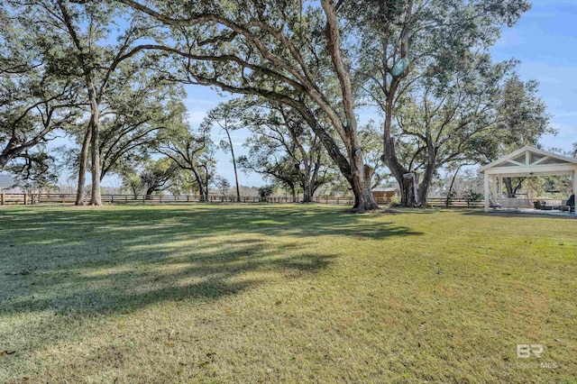 view of yard with a gazebo and a rural view