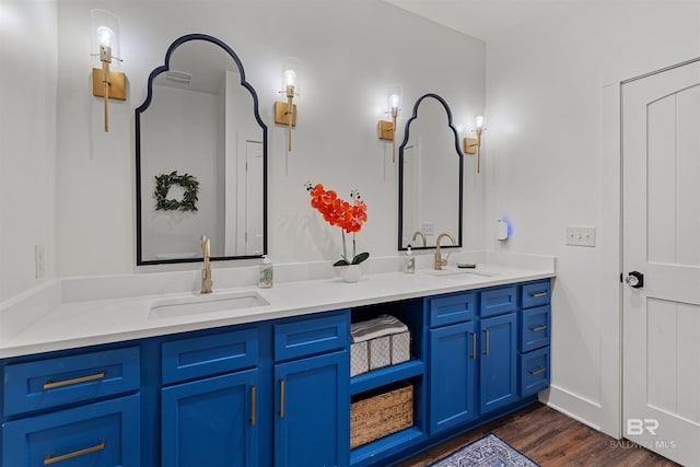 bathroom featuring hardwood / wood-style floors and vanity