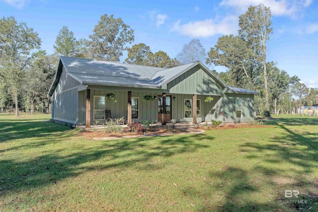 back of house with a lawn and a porch