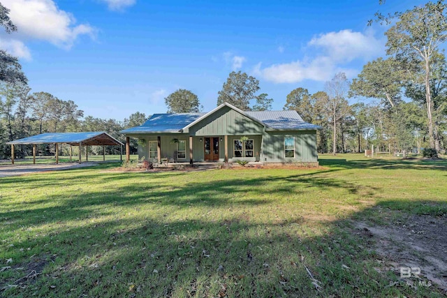 view of front of house with a front yard, a porch, and a carport