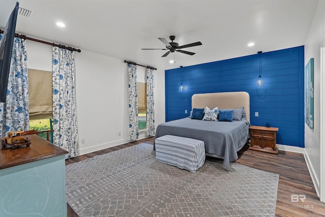 bedroom featuring ceiling fan and dark hardwood / wood-style flooring