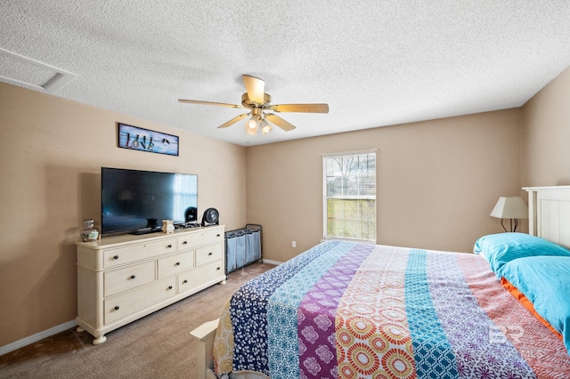 bedroom featuring carpet flooring, ceiling fan, and a textured ceiling