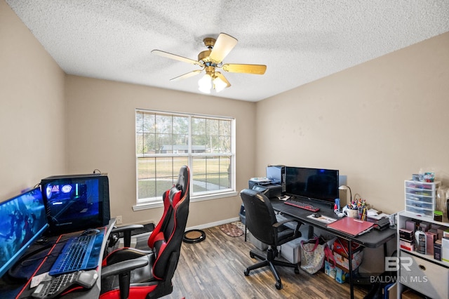 home office with hardwood / wood-style floors, a textured ceiling, and ceiling fan