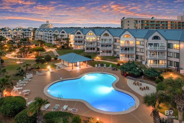 community pool featuring a gazebo and a patio