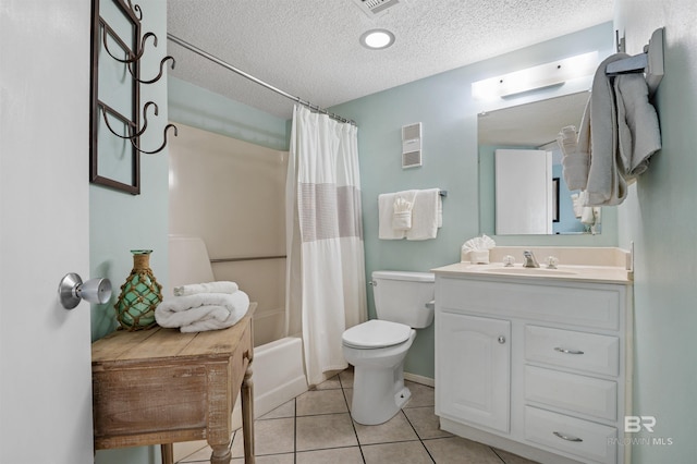full bath with vanity, a textured ceiling, toilet, and tile patterned floors