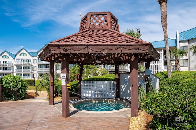 exterior space featuring a gazebo and a jacuzzi