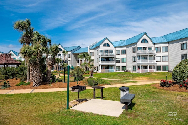 view of home's community with a lawn