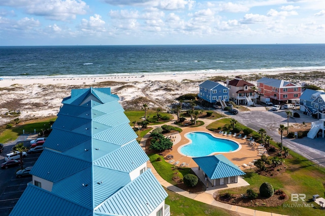 drone / aerial view with a view of the beach and a water view