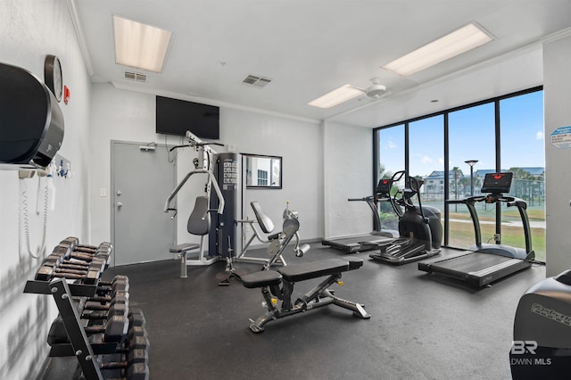 gym featuring expansive windows and visible vents