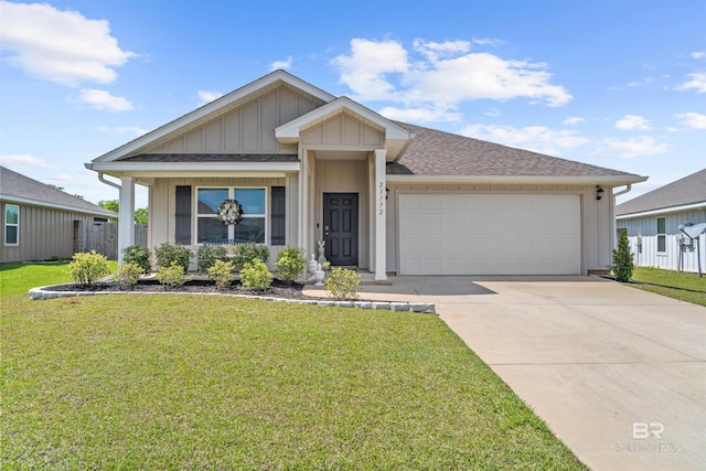ranch-style home featuring roof with shingles, driveway, board and batten siding, a front lawn, and an attached garage