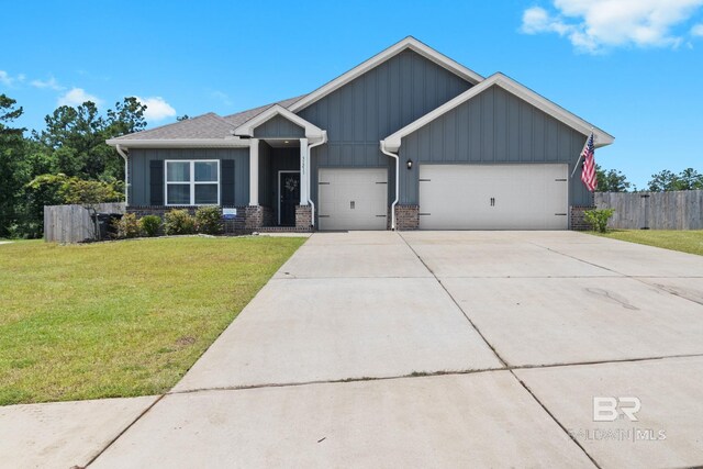 view of front of house with a garage and a yard