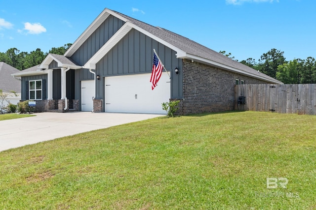 view of front of house with a garage and a front yard