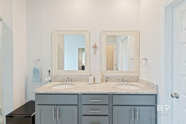 bathroom featuring double vanity